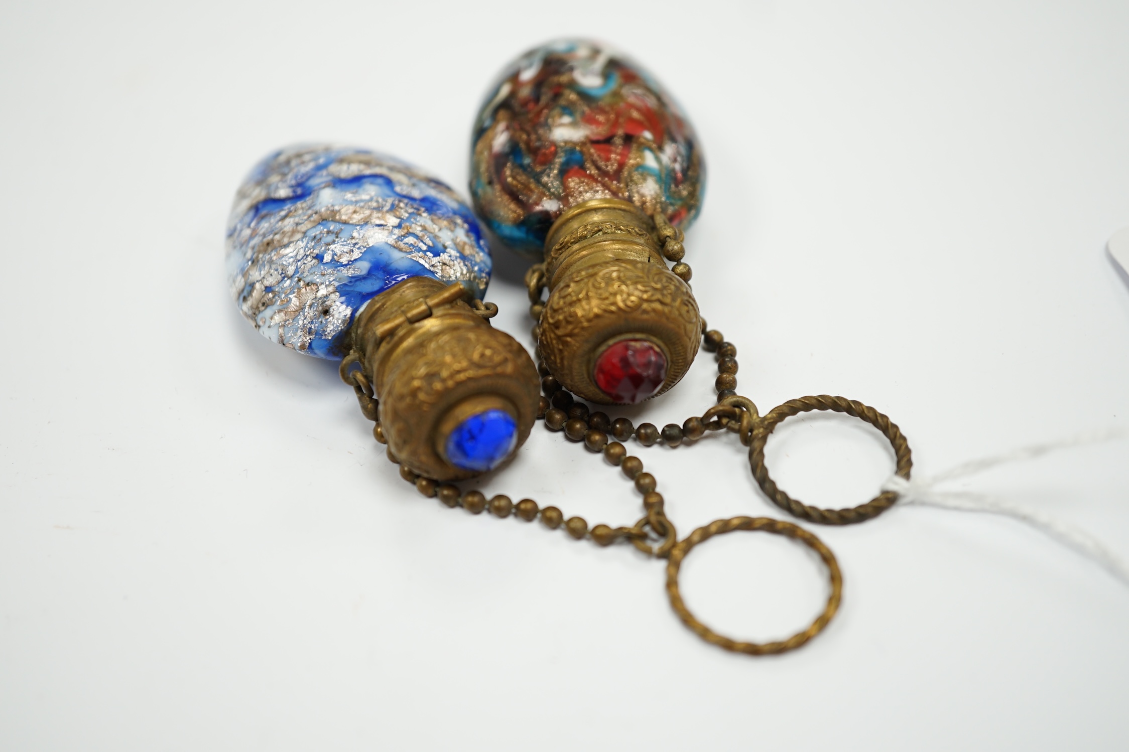 Two Venetian glass scent bottles with aventurine, gilt metal mounted, largest 7.5cm high